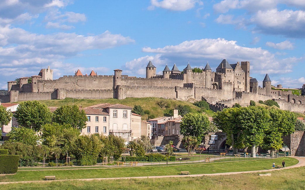 Cité de Carcassonne with Comtal Castle, view of medieval fortress walls and towers.