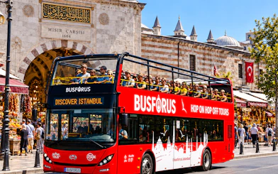 Open-top tour bus in front of Istanbul's Spice Bazaar, part of the 2-day Bosphorus cruise tour.