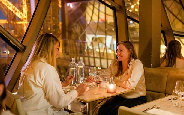 Dining experience on the first floor of the Eiffel Tower in Paris during Christmas.