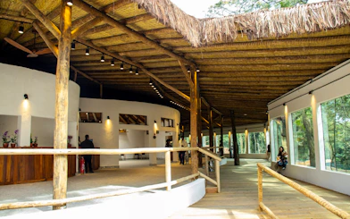Sao Paulo Zoo entrance area with wooden beams and visitors during Simba Safari.