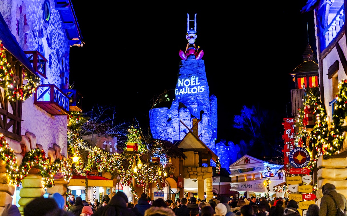 Parc Asterix Christmas celebration with festive lights and decorations.