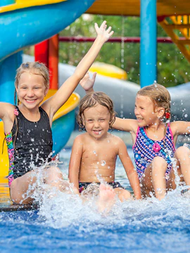 Children playing in the water at Therme Erding water park.