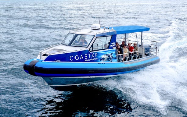 Boat with passengers on Lake Macquarie Coastal Tour.