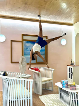 Person posing upside down in a room at Upside Down World Bali.