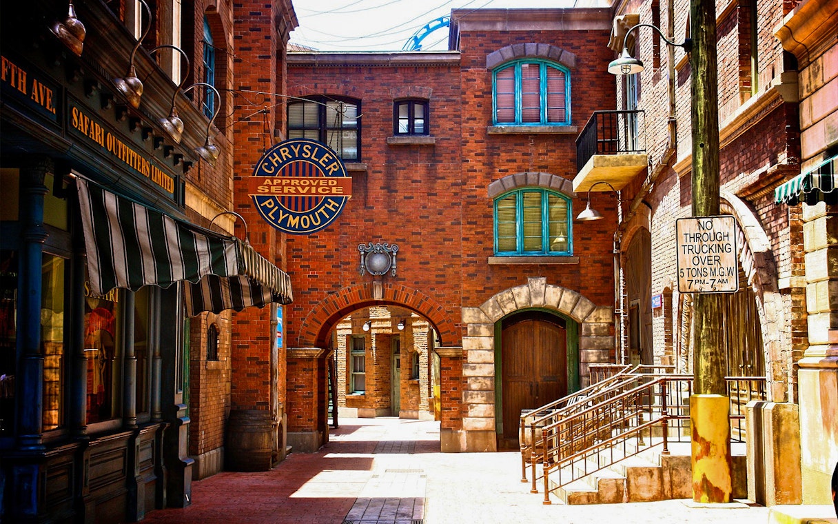 Universal Studios Singapore New York street scene with vintage signs and brick buildings.