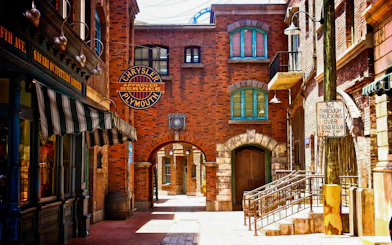 Universal Studios Singapore New York street scene with vintage signs and brick buildings.