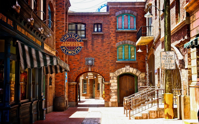 Universal Studios Singapore New York street scene with vintage signs and brick buildings.