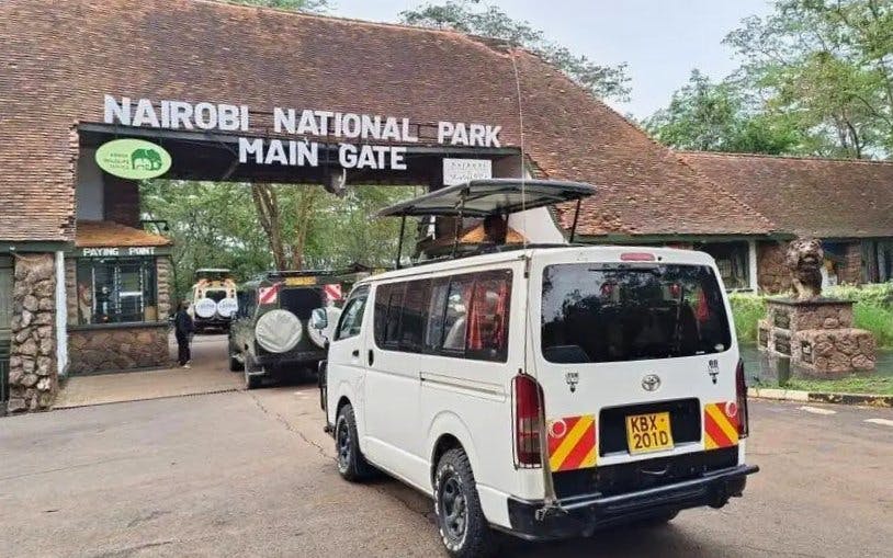 Safari van entering Nairobi National Park main gate, Kenya.