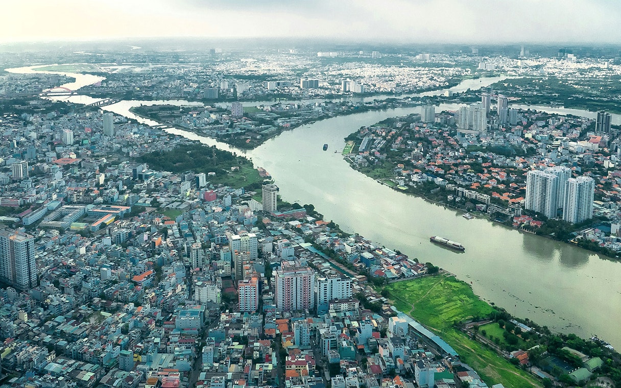 Aerial view of Saigon cityscape and river from Landmark 81 Skyview.