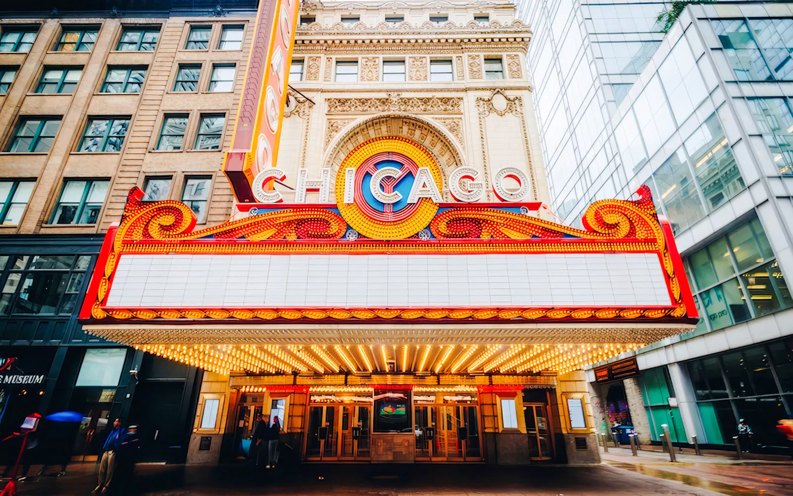 Chicago Theatre marquee with bright lights and iconic sign in downtown Chicago.