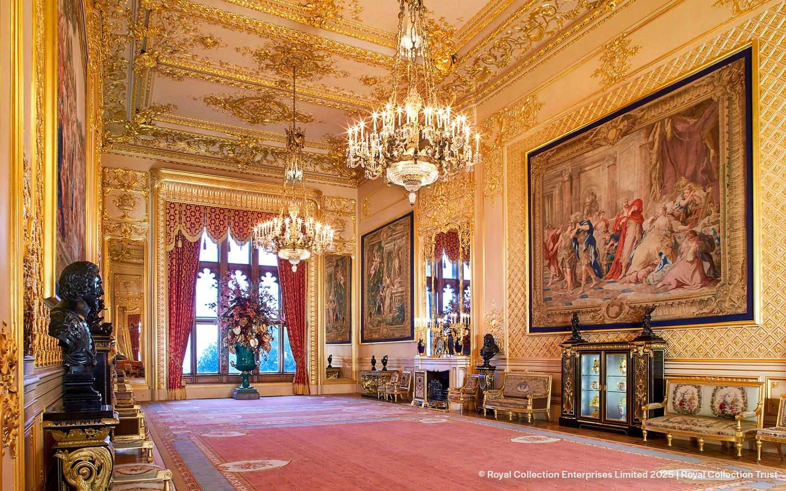 Windsor Castle interior with ornate chandeliers, tapestries, and gilded decor.