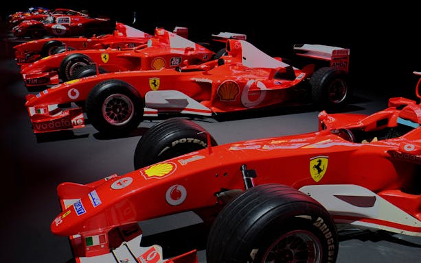 Formula 1 cars displayed at Ferrari Museum in Maranello.