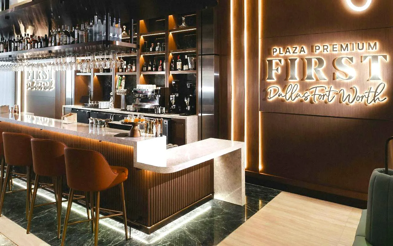 Plaza Premium First Lounge bar area at Dallas Fort Worth International Airport.