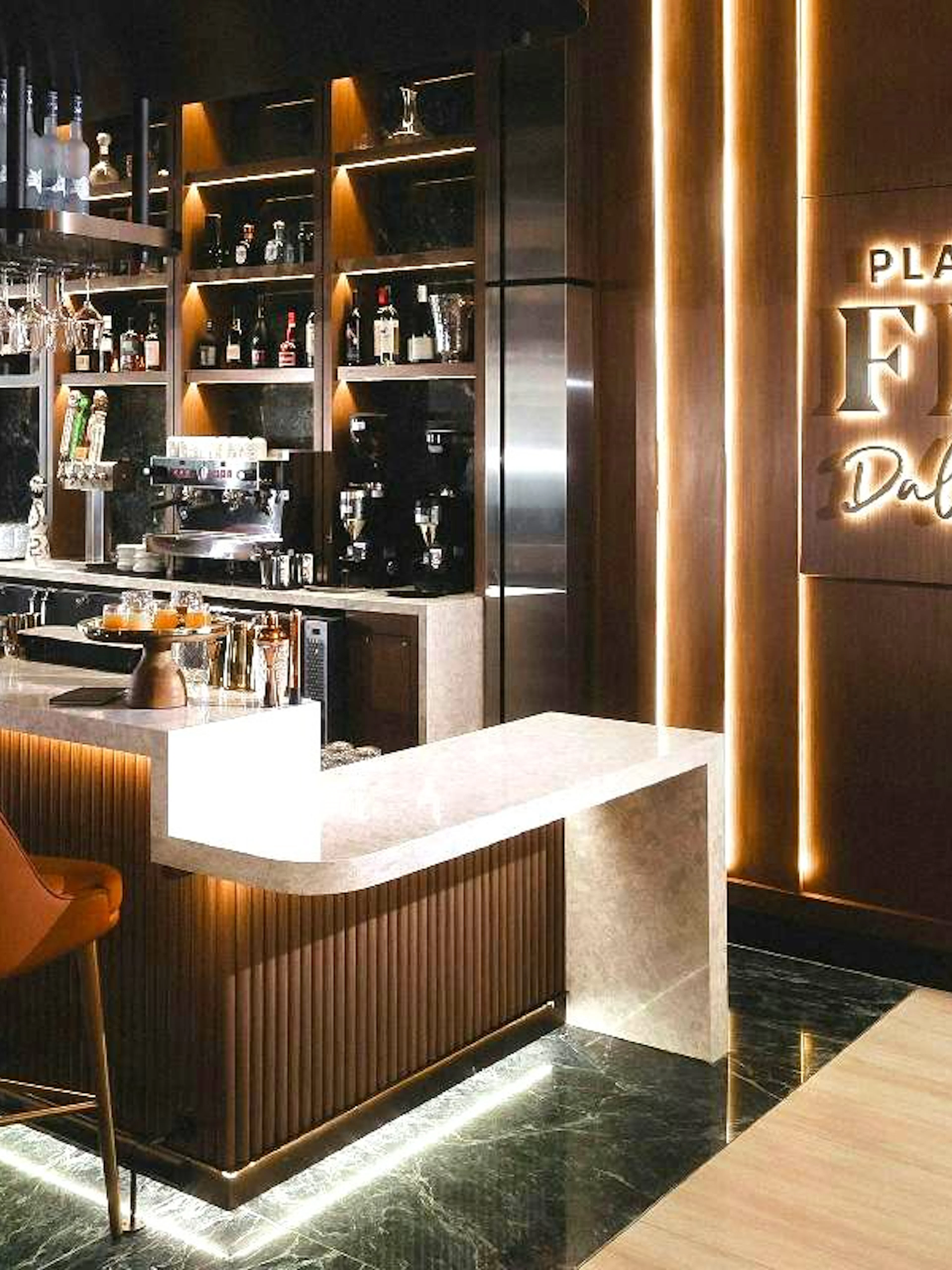 Plaza Premium First Lounge bar area at Dallas Fort Worth International Airport.