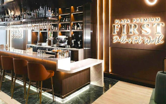 Plaza Premium First Lounge bar area at Dallas Fort Worth International Airport.