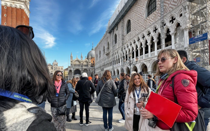 Tour group with guide outside Doge's Palace on Venice Full-Day Guided Tour.