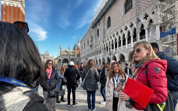 Tour group with guide outside Doge's Palace on Venice Full-Day Guided Tour.