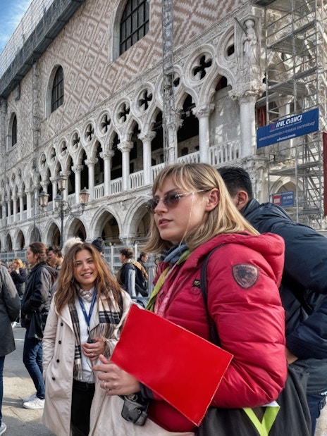 Tour group with guide outside Doge's Palace on Venice Full-Day Guided Tour.