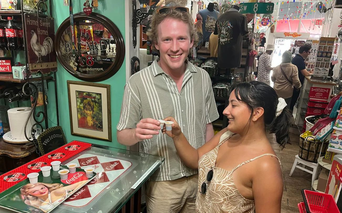 Tourists enjoying Cuban coffee in a Little Havana shop, Miami.