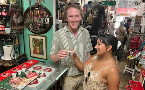 Tourists enjoying Cuban coffee in a Little Havana shop, Miami.