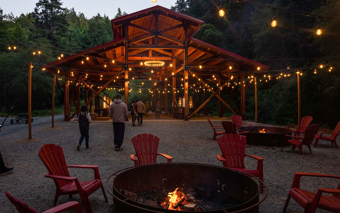 Outdoor seating area with fire pits and string lights at Glen Blair Bar, San Francisco.