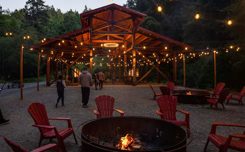 Outdoor seating area with fire pits and string lights at Glen Blair Bar, San Francisco.