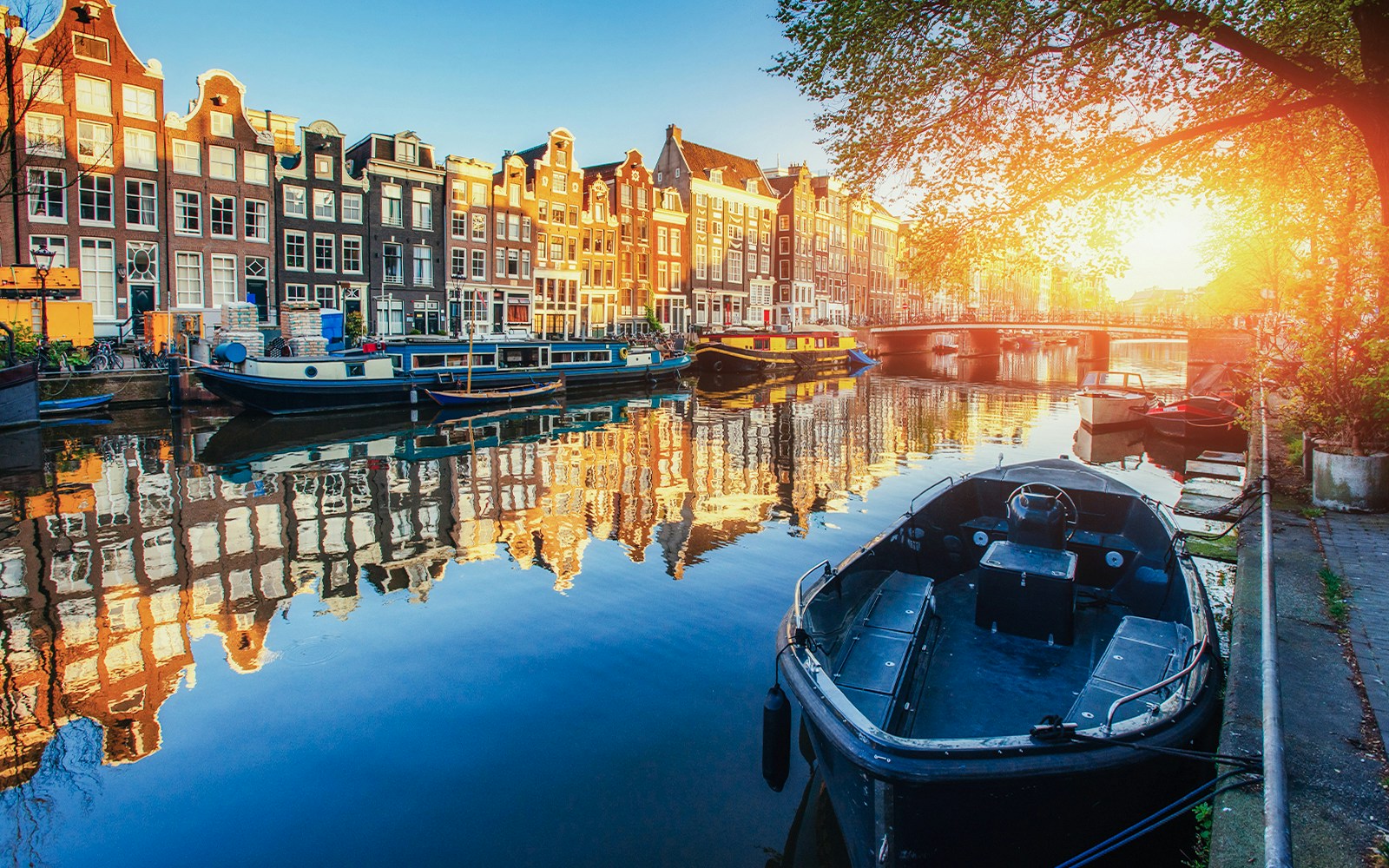 Tourists walking through Amsterdam's Jordaan district near Anne Frank House and Leidseplein.