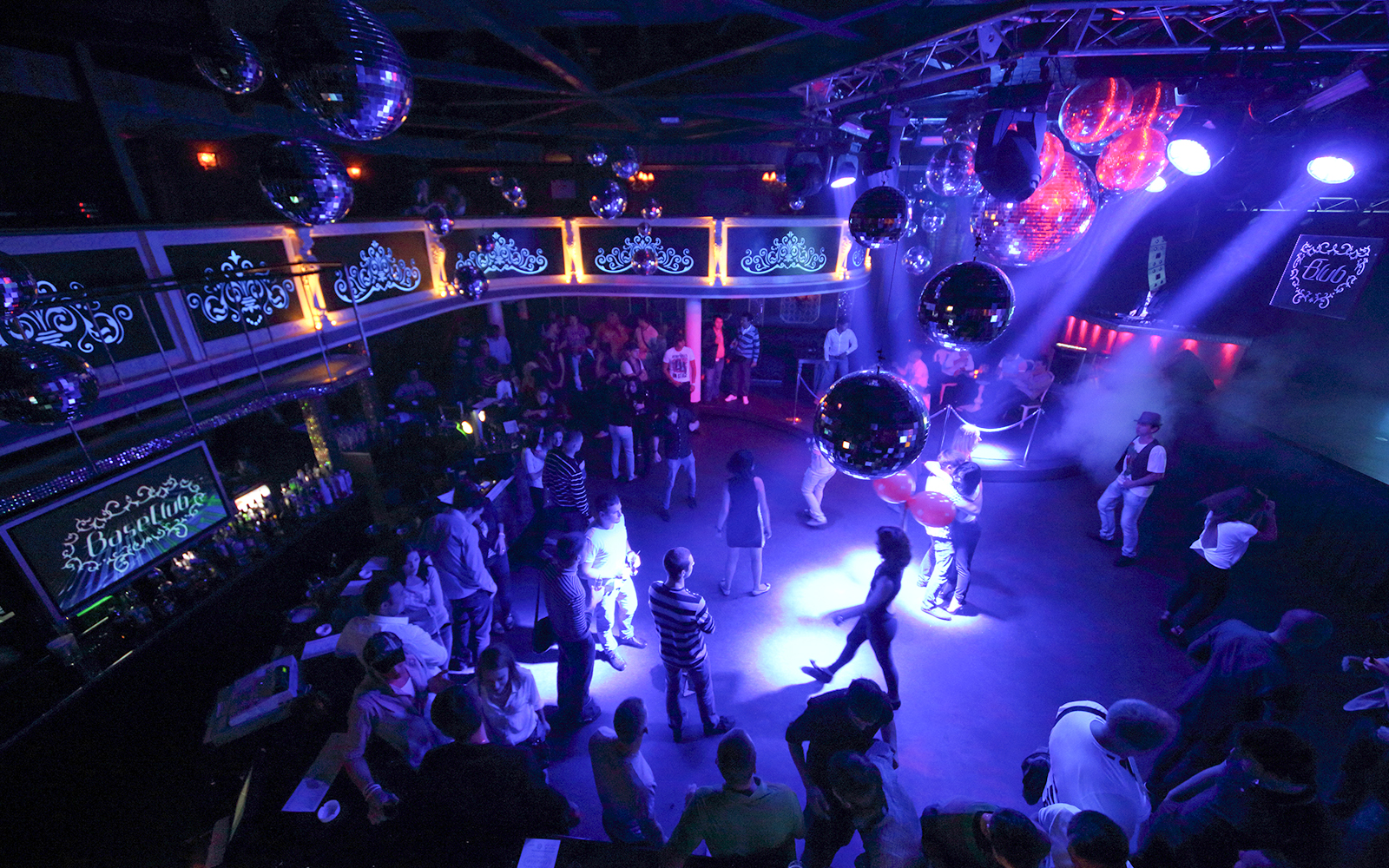 Group of happy multiracial friends dancing at sunrise beach party in summer vacation