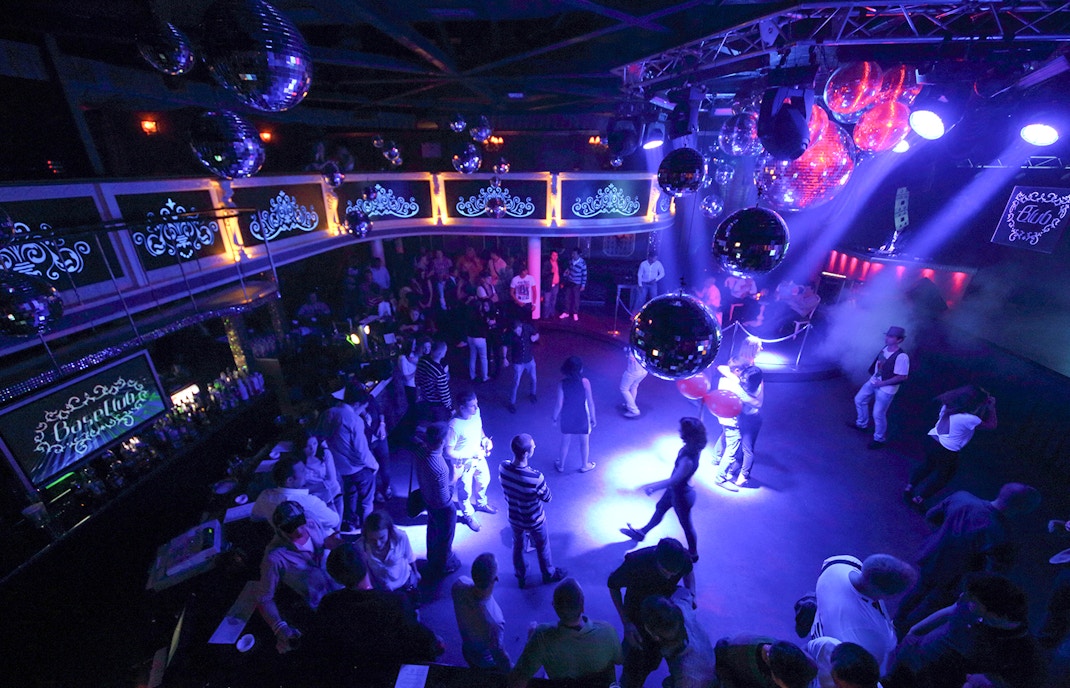 Group of happy multiracial friends dancing at sunrise beach party in summer vacation