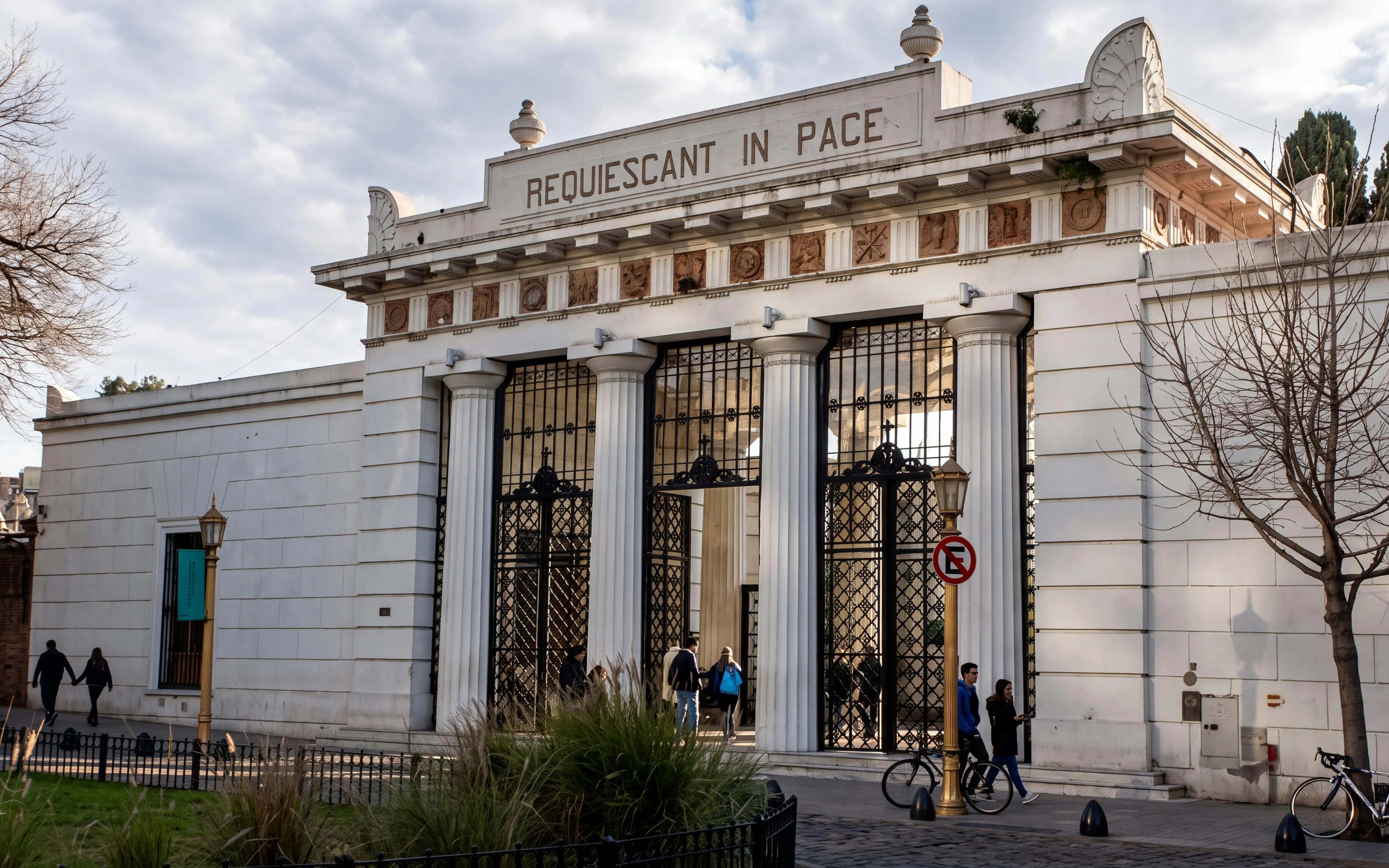 Neoclassical entrance gate of Recoleta Cemetery, Buenos Aires, with "Requiescant in Pace" inscription.