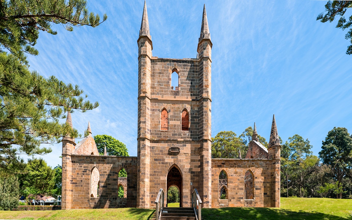 Port Arthur Historic Site, Convict Church ruins with spires and arched windows in Tasmania.