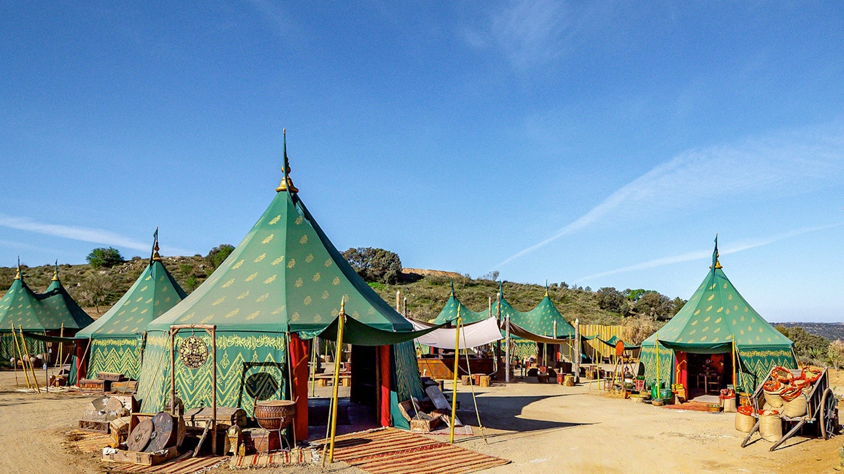 Puy du Fou España park medieval village scene with actors in period costumes.