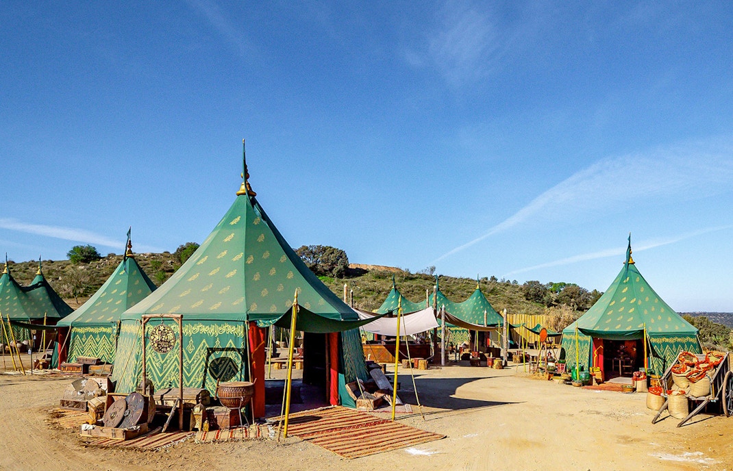 Puy du Fou España park medieval village scene with actors in period costumes.