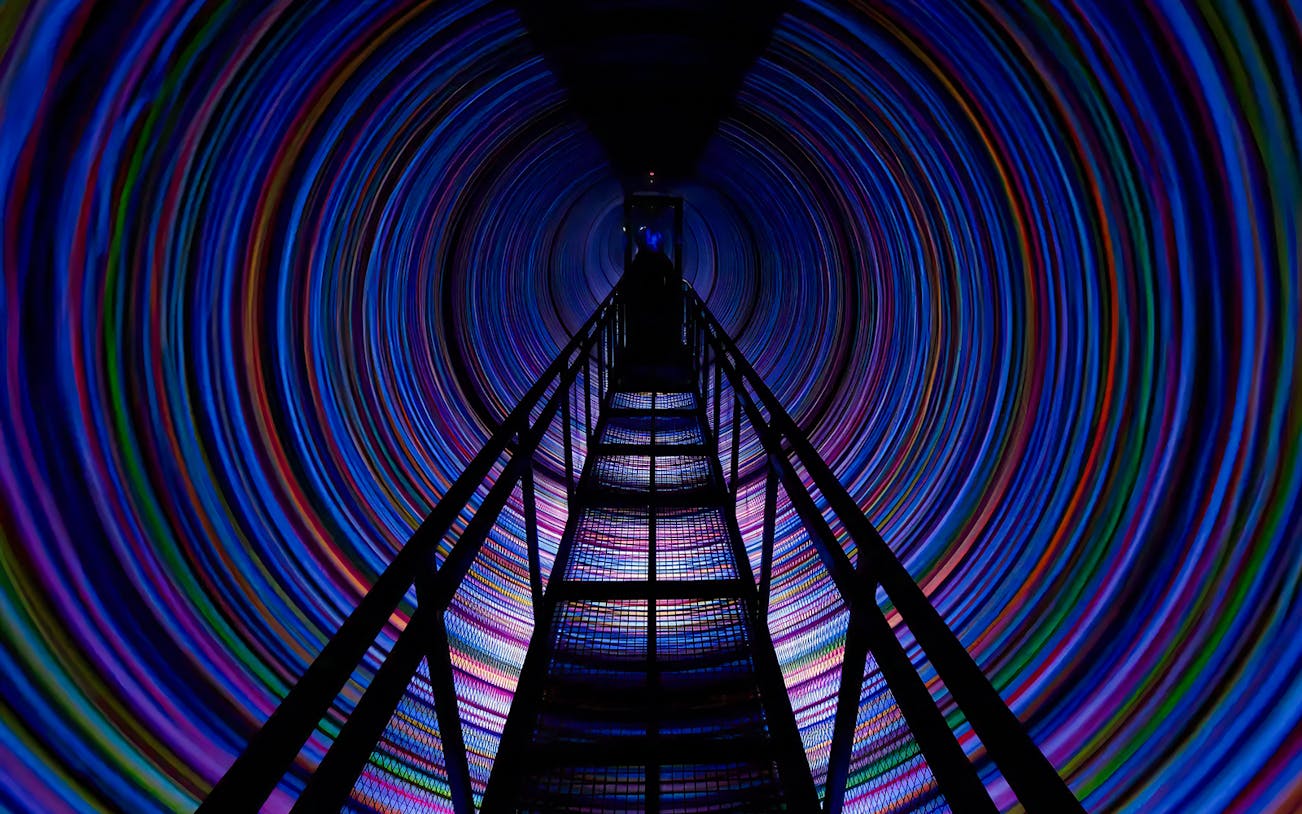 Visitors exploring The Vortex tunnel at the World Of Illusions, Los Angeles.