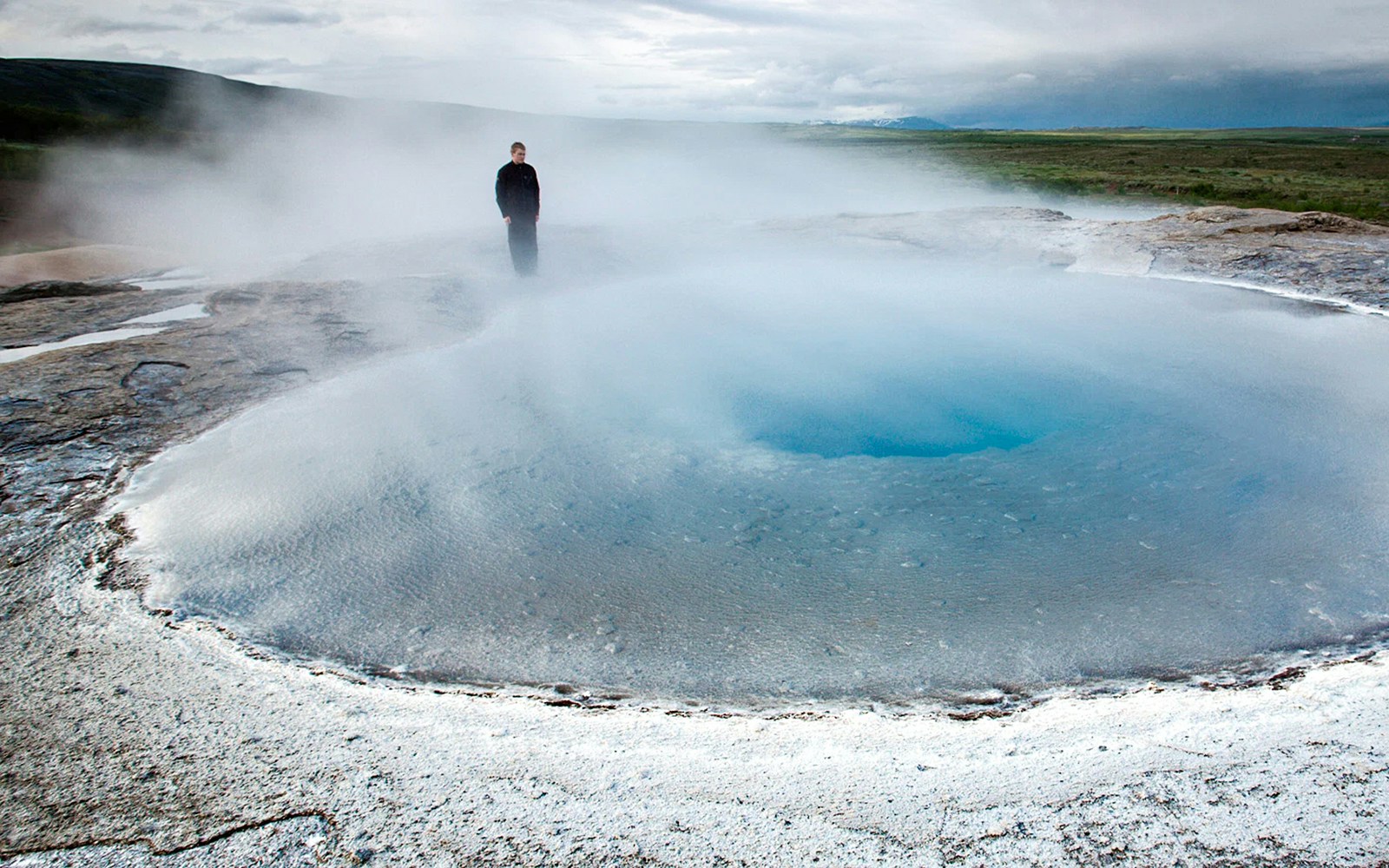 Why visit the Geysir geothermal area?