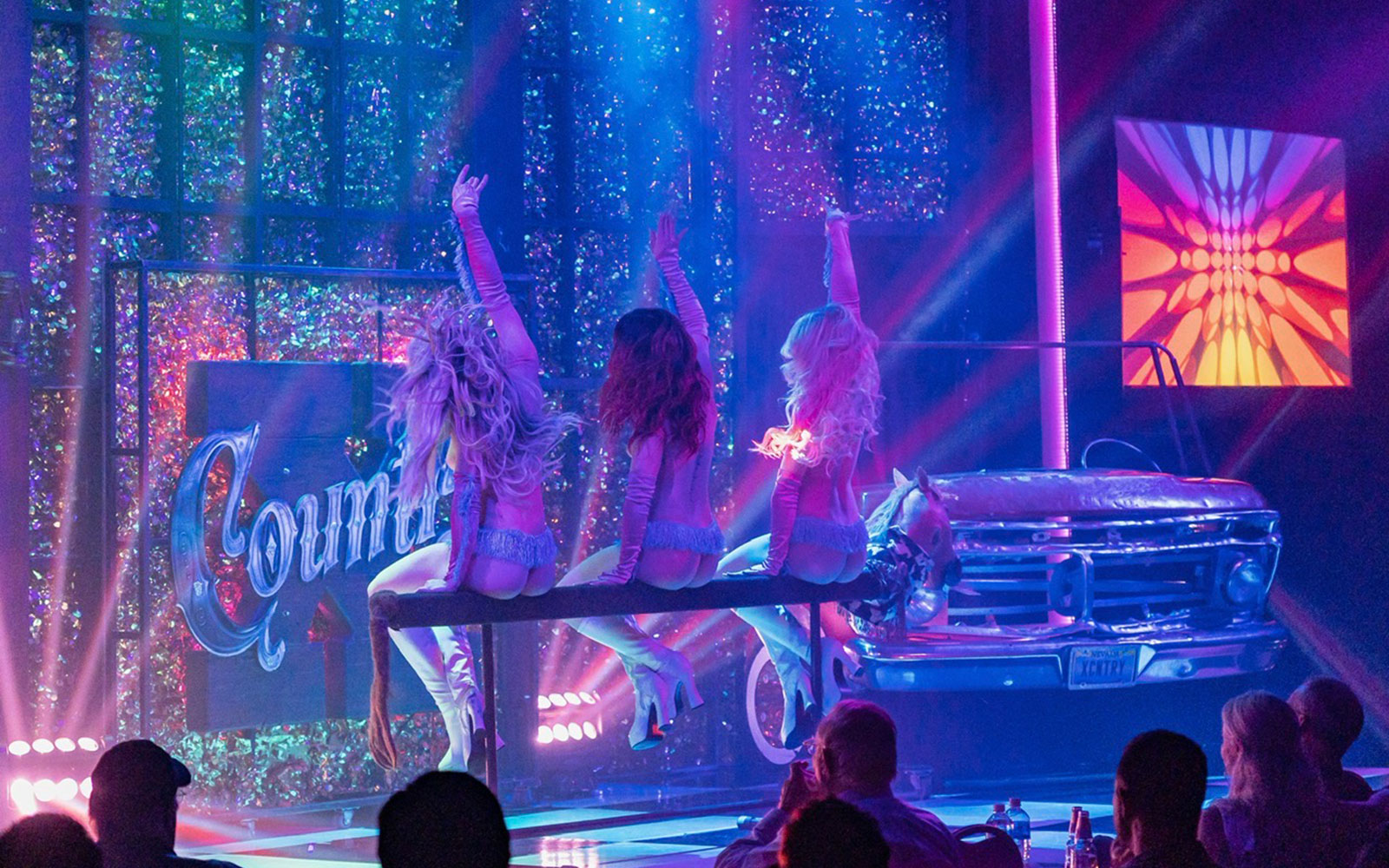 Stage performance of X Country - Kick'n Topless Revue in Vegas with dancers on stage.