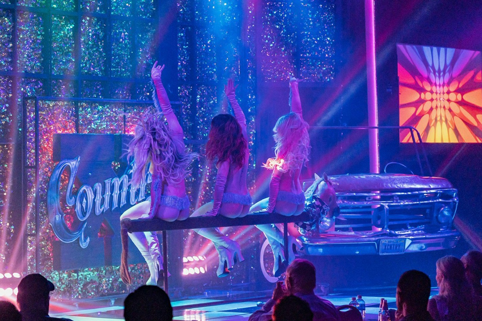 Stage performance of X Country - Kick'n Topless Revue in Vegas with dancers on stage.