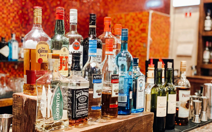 Bar selection at MERA Business Lounge, Terminal 3, Cancún International Airport.