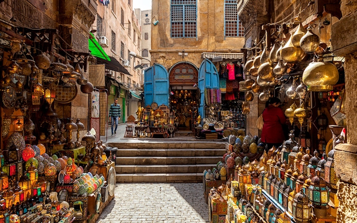 Khan El Khalili Bazaar with colorful lanterns and traditional goods in Cairo, Egypt.