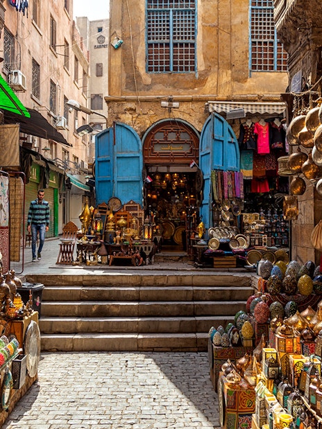 Khan El Khalili Bazaar with colorful lanterns and traditional goods in Cairo, Egypt.