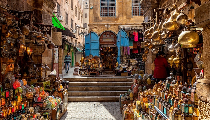 Khan El Khalili Bazaar with colorful lanterns and traditional goods in Cairo, Egypt.