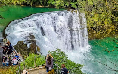 Shifen Waterfall cascading into turquoise pool, Pingxi District, New Taipei City, Taiwan.