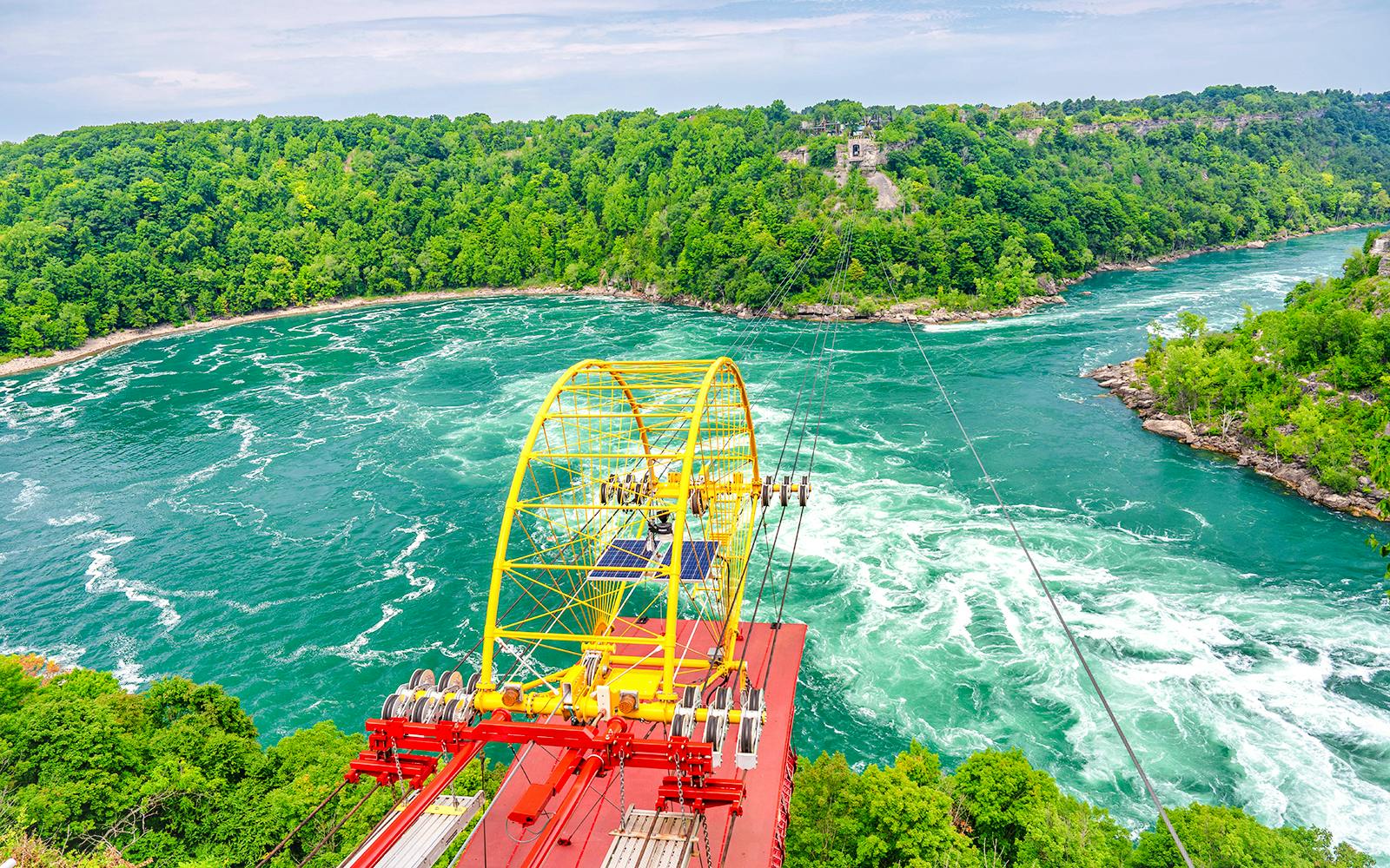 Whirlpool Aero Car crossing over Niagara River rapids, Niagara Falls, Canada.