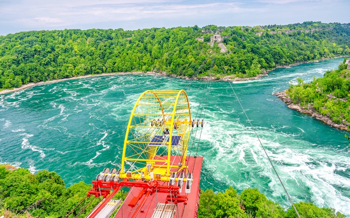 Whirlpool Aero Car crossing over Niagara River rapids, Niagara Falls, Canada.