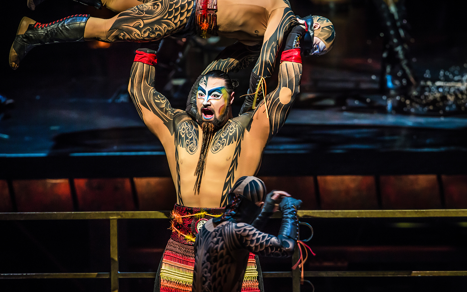 Performer lifting another in Cirque du Soleil KÀ show, Las Vegas.