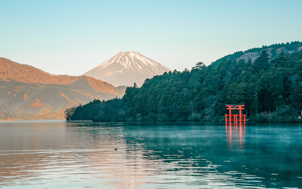 Mount Fuji and red Torii gate at Lake Ashi, Hakone, Japan.