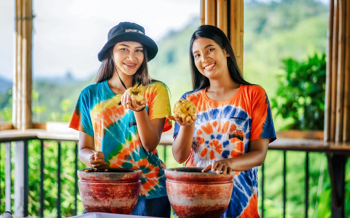 Visitors preparing elephant food at Elephant Jungle Sanctuary, Phuket.