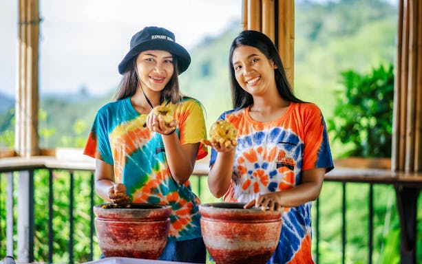 Visitors preparing elephant food at Elephant Jungle Sanctuary, Phuket.