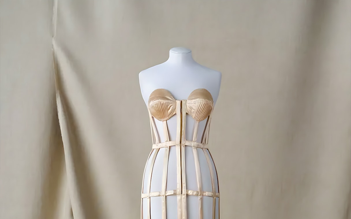 Mannequin displaying a structured corset at Palais Galliera exhibit in Paris.