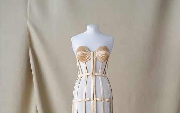 Mannequin displaying a structured corset at Palais Galliera exhibit in Paris.